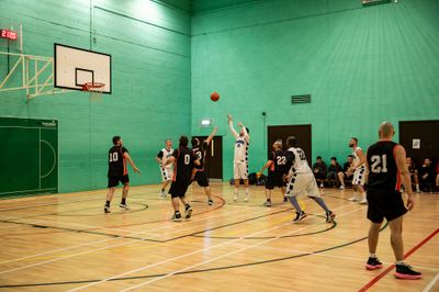 A Ravens player rises for a jump shot during a Herts Basketball League game